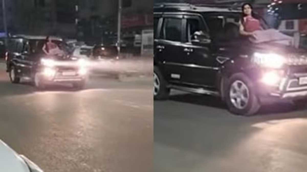 स्कॉर्पियो के बोनट पर बैठकर युवती कर रही स्टंट वीडियो वायरल