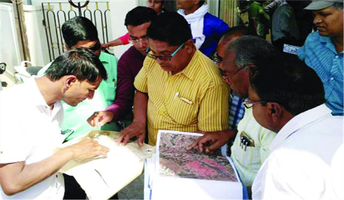 अतिक्रमण की शिकायत पर प्रशासन ने कराई नापजोख