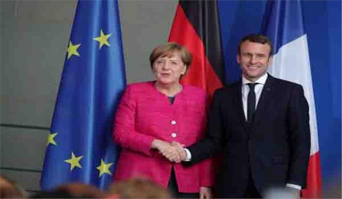 इमैनुएल मैक्रों और एंजेला मर्केल ने यूक्रेन में कैदियों की अदला-बदली को सराहा