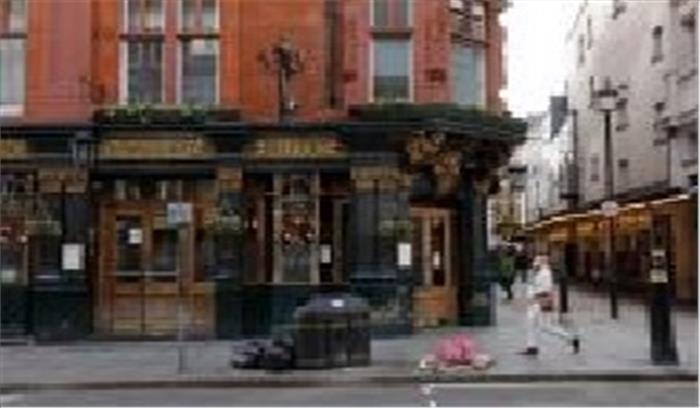 कोविड-19 : ब्रिटेन में 9,875 लोगों की मौत